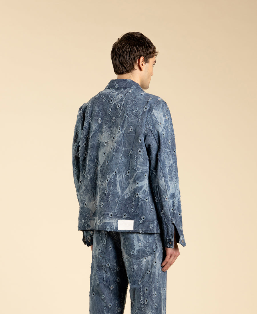 Giacca in denim blu con rotture