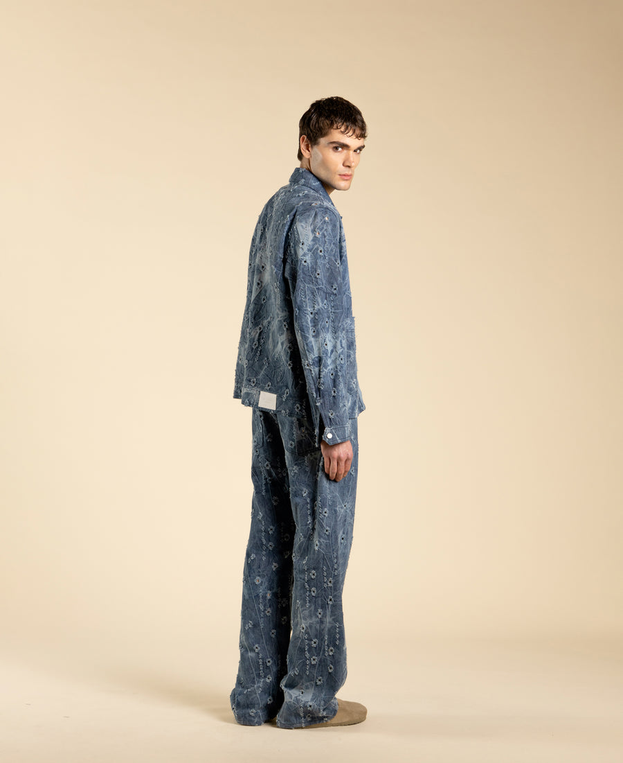 Giacca in denim blu con rotture