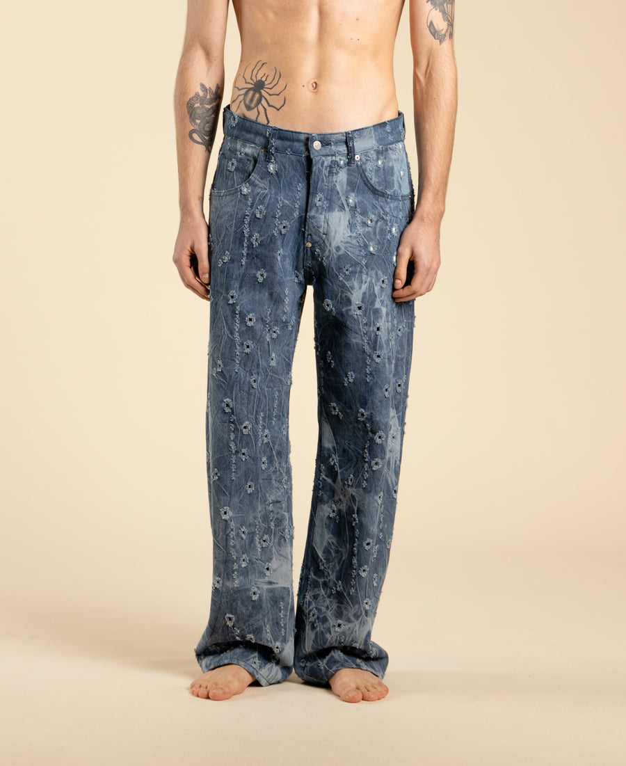 Jeans ampi in denim blu con rotture