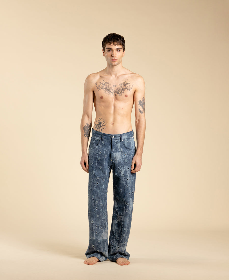 Jeans ampi in denim blu con rotture